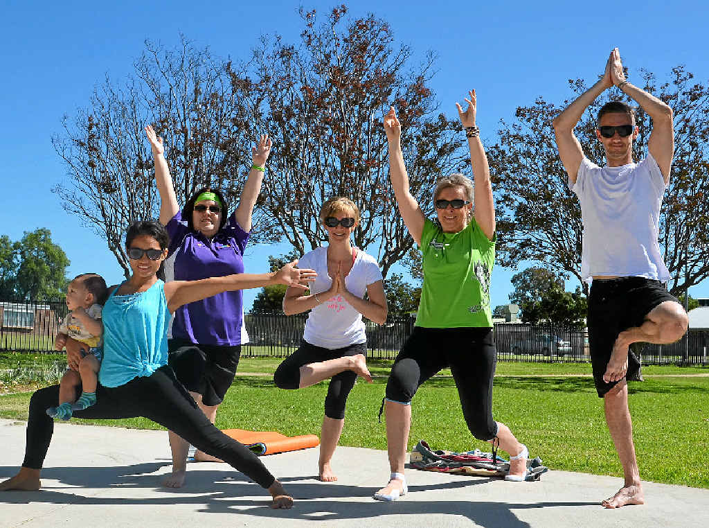 HEALTHY BALANCE: Jiram and baby Jake Gibson, Elizabeth Dennis, yoga instructor Jes Kerle and Headspace’s Gaye Hutchinson and Travis Maguire enjoyed a free yoga class in the Warwick Youthspace in Leslie Park yesterday.